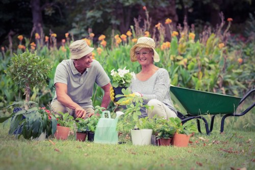 Gardeners working safely in Slade Green with protective equipment