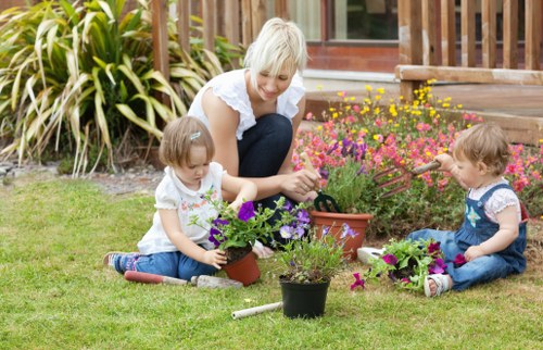 Gardener inspecting outdoor work area for safety risks